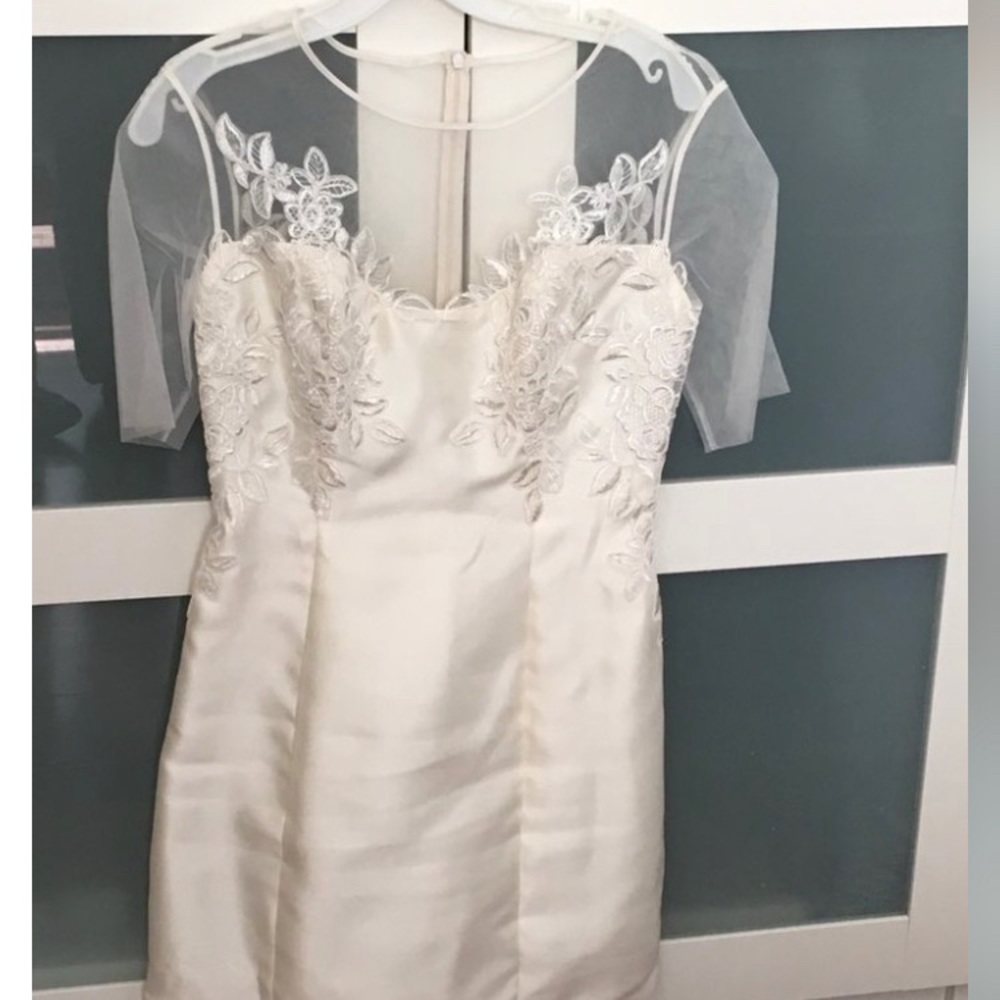 white noir boutique dress,comes with added tutu belt that can be added